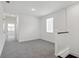 Hallway featuring neutral walls and carpet leading to bright natural light at 15543 Gentle Rain Dr # 197, Winter Garden, FL 34787
