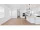 Open-concept kitchen with a large island, modern appliances, and sleek finishes for seamless entertaining at 15543 Gentle Rain Dr # 197, Winter Garden, FL 34787