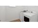 Bright Laundry Room features updated appliances and neutral walls at 15543 Gentle Rain Dr # 197, Winter Garden, FL 34787
