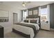 Comfortable primary bedroom with a soft color palette and natural light at 15567 Gentle Rain Dr # 194, Winter Garden, FL 34787