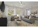 Bright and airy living room featuring comfortable seating, stylish decor, and natural light at 15567 Gentle Rain Dr # 194, Winter Garden, FL 34787