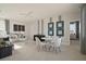 Spacious living area with stylish furniture, decorative artwork, and ample natural light at 15567 Gentle Rain Dr # 194, Winter Garden, FL 34787