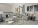 Comfortable living area featuring a sectional sofa and colorful decor at 15567 Gentle Rain Dr # 194, Winter Garden, FL 34787