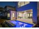 Stunning outdoor space with pool, summer kitchen, and seamless transition to indoor living at 15847 Vetta Dr, Bella Collina, FL 34756