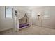 Cozy bedroom featuring a canopy bunk bed, plush carpet, and neutral walls at 15847 Vetta Dr, Bella Collina, FL 34756