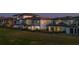 Beautiful neighborhood featuring modern home exteriors with lush landscaping and an expansive green lawn at 15847 Vetta Dr, Bella Collina, FL 34756