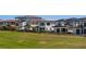 Modern home exterior featuring lush landscaping and an expansive green lawn at 15847 Vetta Dr, Bella Collina, FL 34756