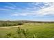 Scenic view of a lush golf course with rolling hills and sand traps, perfect for golf enthusiasts at 15847 Vetta Dr, Bella Collina, FL 34756