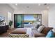 Comfortable living room featuring a plush sofa and sliding glass doors leading to an outdoor pool area at 15847 Vetta Dr, Bella Collina, FL 34756