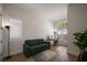 Bright office space featuring a sofa, desk, wood floors, and plantation shutters with a scenic view at 15847 Vetta Dr, Bella Collina, FL 34756