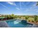 Backyard pool featuring water feature, landscaping, and a lush green view on a sunny day at 15847 Vetta Dr, Bella Collina, FL 34756