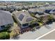 Aerial view of home with solar panels, covered patio and well maintained landscaping at 16144 Parkwyn St, Winter Garden, FL 34787