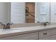 Close-up view of a bathroom vanity featuring double sinks, modern fixtures, and ample counter space at 16144 Parkwyn St, Winter Garden, FL 34787