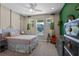 Bright bedroom features a large window, stylish decor, and a cozy, inviting atmosphere at 16144 Parkwyn St, Winter Garden, FL 34787