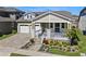 Charming home featuring a two-car garage and a beautifully landscaped front yard at 16144 Parkwyn St, Winter Garden, FL 34787
