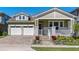 Charming home featuring a two-car garage and a beautifully landscaped front yard at 16144 Parkwyn St, Winter Garden, FL 34787