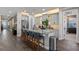 Open kitchen with gray cabinets, granite counters, a large island, and stainless appliances at 16144 Parkwyn St, Winter Garden, FL 34787