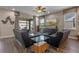 Bright living room with sliding glass doors to a backyard, modern furniture, and tile floors at 16144 Parkwyn St, Winter Garden, FL 34787