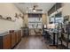 Well-lit home office with wooden flooring, dual monitors, and contemporary furnishings for a productive workspace at 16144 Parkwyn St, Winter Garden, FL 34787