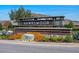 Landscaped Hawksmoor neighborhood sign set against a beautiful blue sky at 16144 Parkwyn St, Winter Garden, FL 34787