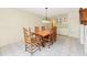 Dining area with a large wooden table, traditional chairs, and built-in cabinets at 215 Forrest Dr, Sanford, FL 32773