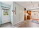 Spacious garage interior featuring white walls, cabinetry, concrete floor and exterior door at 215 Forrest Dr, Sanford, FL 32773