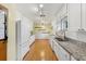 Functional kitchen with white cabinetry, updated countertops, and modern appliances at 215 Forrest Dr, Sanford, FL 32773