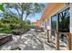 Charming patio with brick planters and a table and chair seating area at 215 Forrest Dr, Sanford, FL 32773