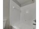 Bathroom featuring white tiled shower and updated faucet at 2156 Fish Eagle St, Clermont, FL 34714