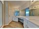 Bright and airy bathroom featuring a large vanity and modern lighting at 2156 Fish Eagle St, Clermont, FL 34714