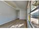 Bright bedroom with large windows and a closet, with wood-look floors at 2156 Fish Eagle St, Clermont, FL 34714