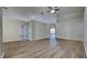 Spacious open floor plan with wood floors and archways leading to other rooms at 2156 Fish Eagle St, Clermont, FL 34714