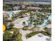 Community aerial view showcasing multiple pools, ponds, and recreation areas at 218 Ocean Course Ave, Davenport, FL 33896