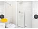 Bright bathroom with a glass-enclosed shower and modern fixtures at 218 Ocean Course Ave, Davenport, FL 33896