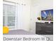 Well-lit downstairs bedroom with a dresser and neutral decor at 218 Ocean Course Ave, Davenport, FL 33896