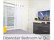 Bright bedroom with a mounted television, dresser, and large windows at 218 Ocean Course Ave, Davenport, FL 33896