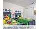 Colorful bedroom featuring two beds and playful decor at 218 Ocean Course Ave, Davenport, FL 33896