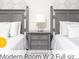 Charming bedroom with two beds, offering comfort and style at 218 Ocean Course Ave, Davenport, FL 33896