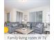 Cozy living room with modern sofas, stylish decor, and plenty of natural light at 218 Ocean Course Ave, Davenport, FL 33896