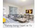 Comfortable living room featuring plush seating, contemporary decor, and a mounted TV at 218 Ocean Course Ave, Davenport, FL 33896
