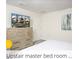 Bright primary bedroom includes a dresser and soft textures, creating a relaxing retreat at 218 Ocean Course Ave, Davenport, FL 33896
