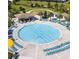 Large community pool with lounge chairs and ample deck space at 218 Ocean Course Ave, Davenport, FL 33896