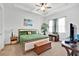Bright bedroom features a ceiling fan, neutral walls, and natural light at 2312 Datura Loop, St Cloud, FL 34772