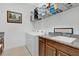 Convenient laundry room with a utility sink, overhead storage, and a full-size washer and dryer at 2312 Datura Loop, St Cloud, FL 34772