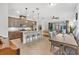Bright open floor plan with kitchen featuring modern appliances and dining area at 2312 Datura Loop, St Cloud, FL 34772