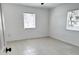 Bright bedroom with tile flooring and two windows for plenty of natural light at 236 Eldorado Dr, Debary, FL 32713