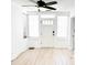 Bright entryway with new flooring, windows and a modern ceiling fan and new lighting at 236 Eldorado Dr, Debary, FL 32713