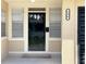 A close up of the front door with address number and window, shows curb appeal at 236 Eldorado Dr, Debary, FL 32713