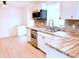 Beautiful kitchen with mosaic backsplash, wood counters, stainless steel appliances and a window at 236 Eldorado Dr, Debary, FL 32713
