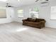 Large living room with lots of natural light, a ceiling fan and laminate floors at 236 Eldorado Dr, Debary, FL 32713